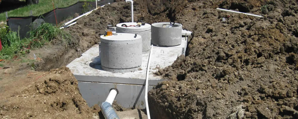 Septic system repair and installation site with tank access ports in Detroit, MI