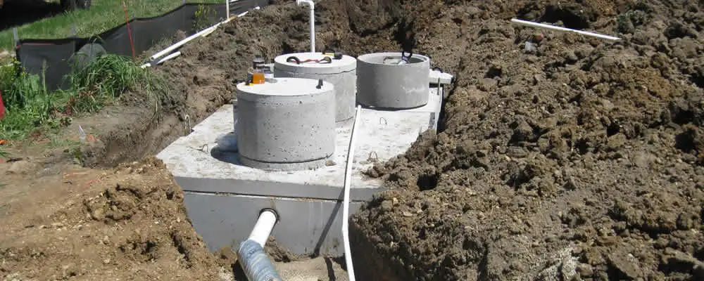 Septic system repair and installation site with tank access ports in Detroit, MI