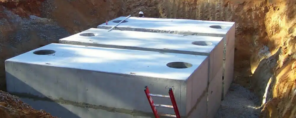 Septic tank installation site with a newly placed concrete tank in Detroit, MI